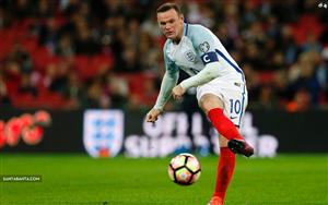 English footballer Wayne Rooney striking a ball